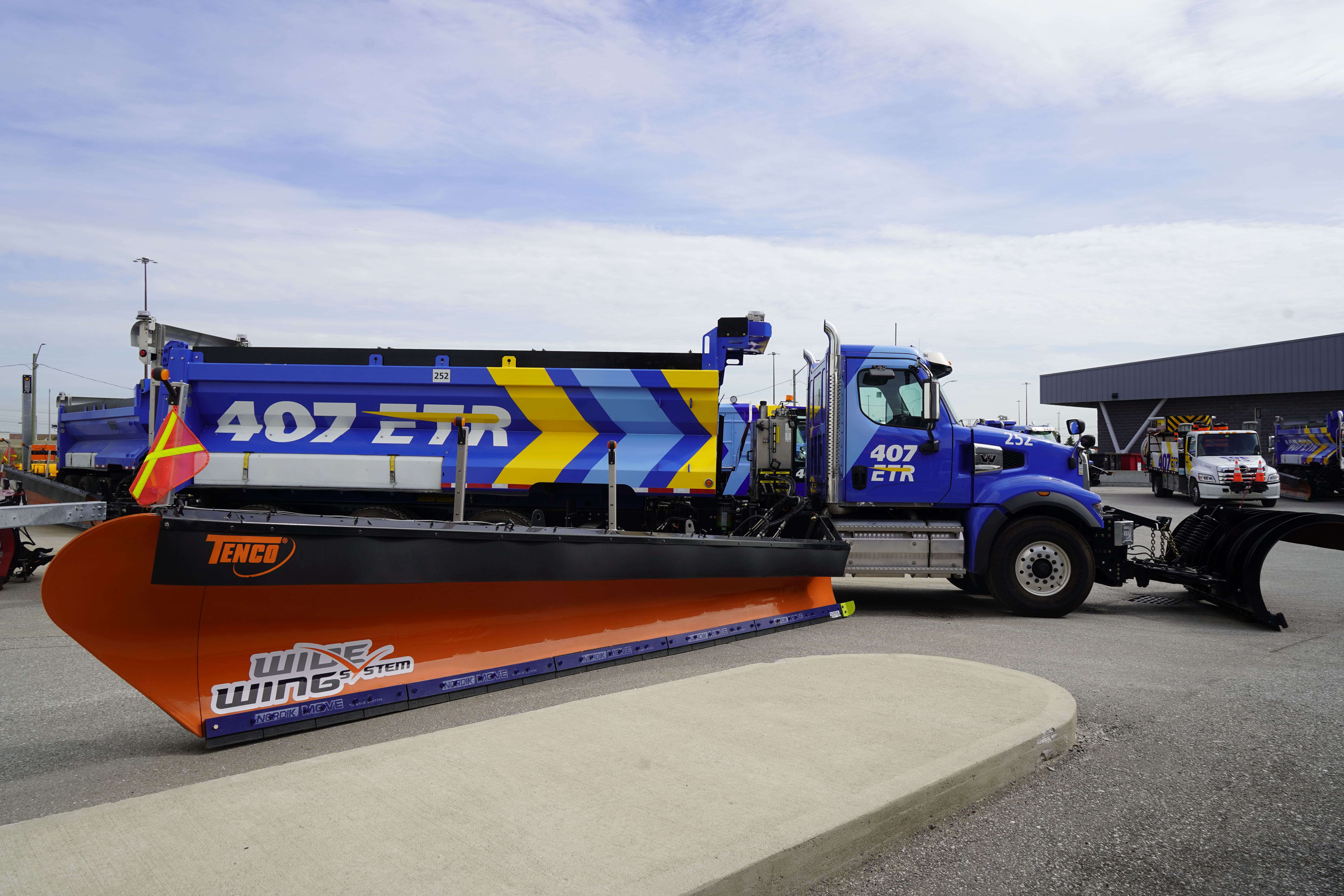 407 ETR wide wing snow plow truck