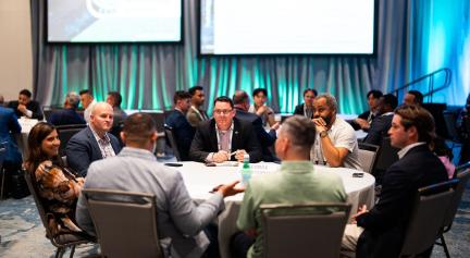 group of people sitting at a round table