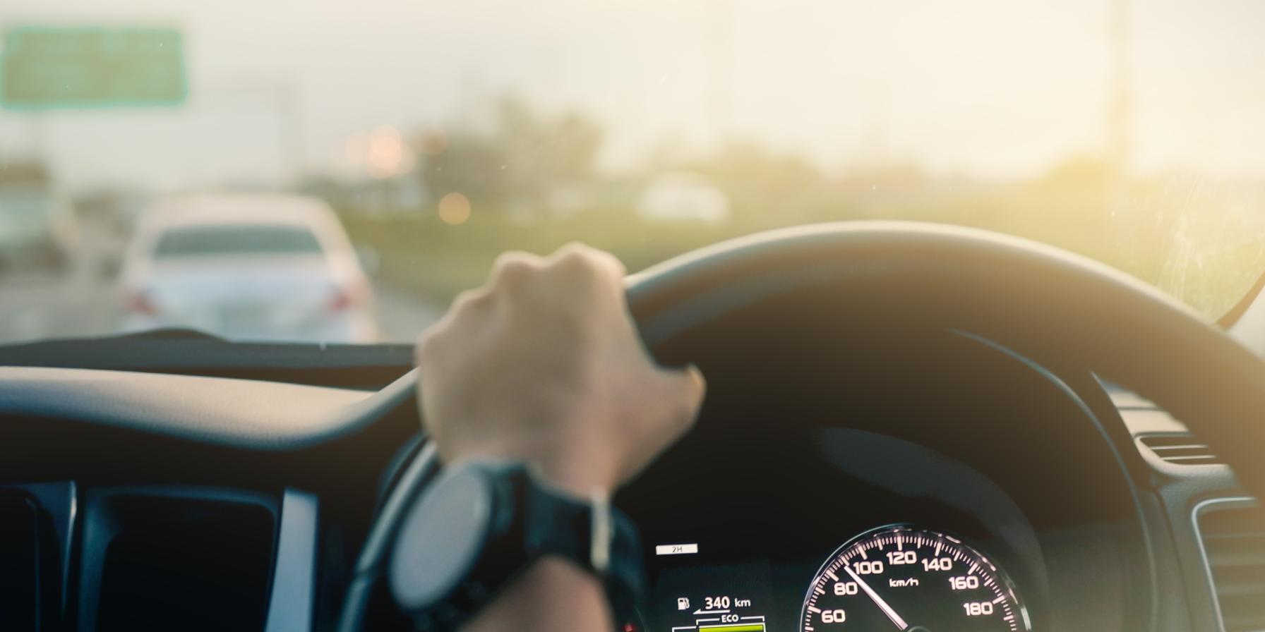 Hand on Steerting Wheel in car