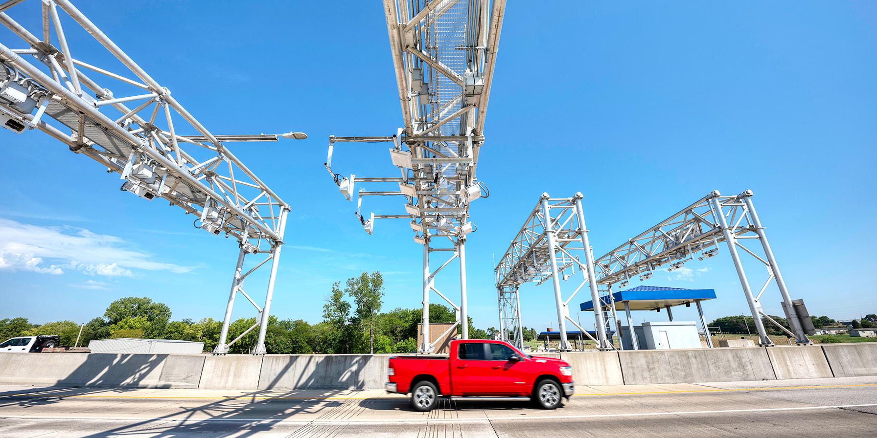Red Truck passing under All Electronic Tolling Gantry on the Kansas Turnpike