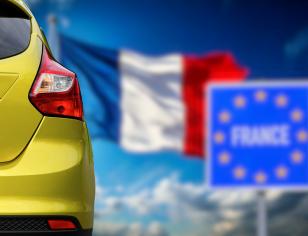 modern car with French flag in sight