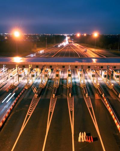 aerial view of a toll plaza at night